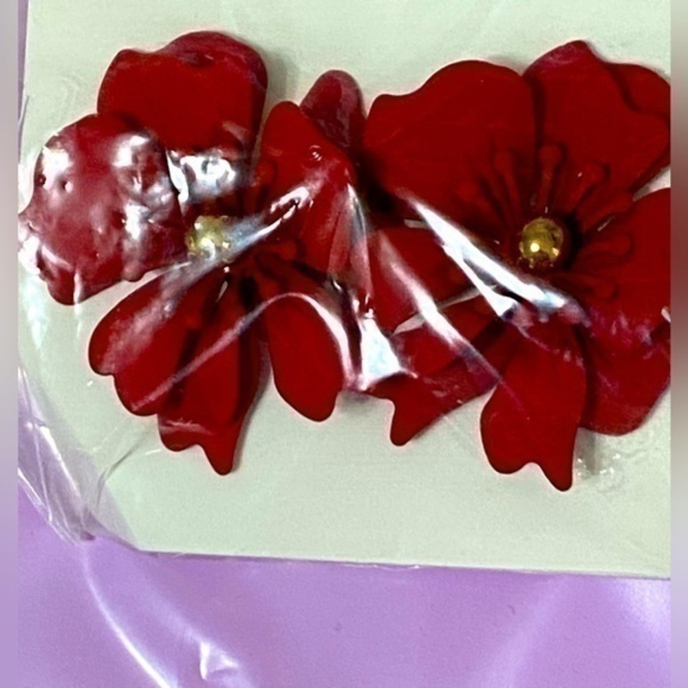 Red metal flower stud earrings. Brand New studs with gorgeous pearls …